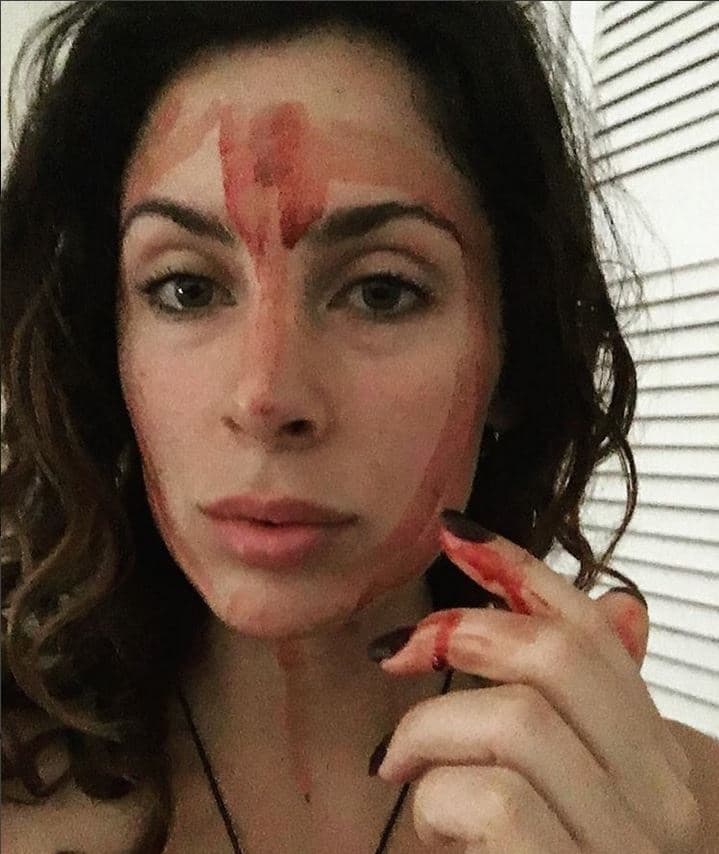 WATCH: WOMAN PUTS PERIOD BLOOD ON HER FACE!